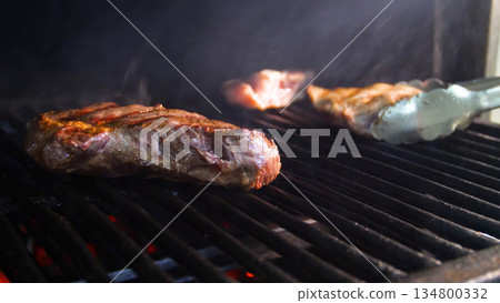 Steakhouse. Steaks are roasted on a josper oven. Frying a steak on a josper. 134800332