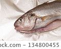 The gills and innards of the Ishimochi fish are removed and it is baked in foil. 134800455