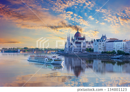 Aerial view of cruise ship and Budapest Parliament under sunrise sky, Hungary Aerial view of cruise ship and Budapest Parliament under sunrise sky, Hungary 134801123
