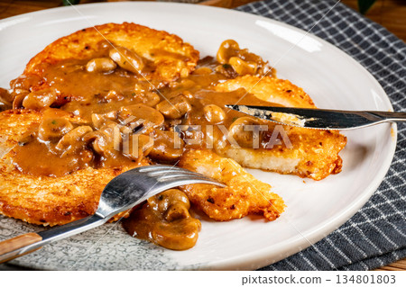 Crispy potato pancakes with mushroom sauce Crispy potato pancakes with mushroom sauce 134801803