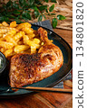 Crispy roasted chicken leg with french fries. 134801820