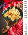 Dumplings with potato and cheese filling. 134801825