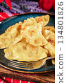 Dumplings with potato and cheese filling. 134801826