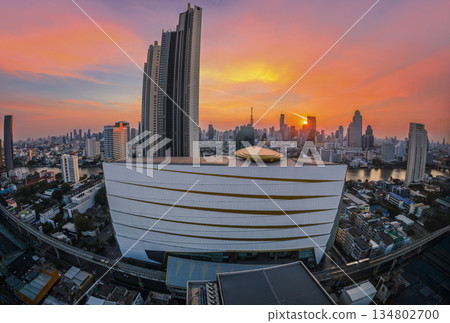 Cityscape building modern business district of Bangkok. Interchange station, sky train railway in the foreground at twilight time. 134802700