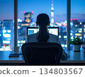 A woman working overtime until late at night in the office 134803567