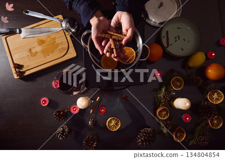 Warm Mulled Wine Preparation Scene With Spices And Citrus For Winter Holiday Table Warm Mulled Wine Preparation Scene With Spices And Citrus For Winter Holiday Table 134804854