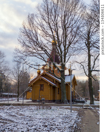 Traditional Wooden Orthodox Church with Golden Domes in Winter Traditional Wooden Orthodox Church with Golden Domes in Winter 134806611