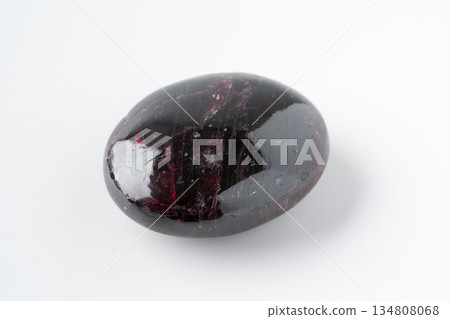Garnet rough stone on white background 134808068