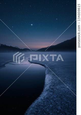 Serene and peaceful scene of a river with a starry sky above 134808615