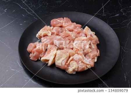 Domestic raw chicken thighs 134809079
