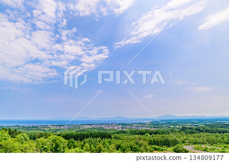 A view of the city and the Shiretoko mountain range from Mount Tento in Abashiri A view of the city and the Shiretoko mountain range from Mount Tento in Abashiri 134809177