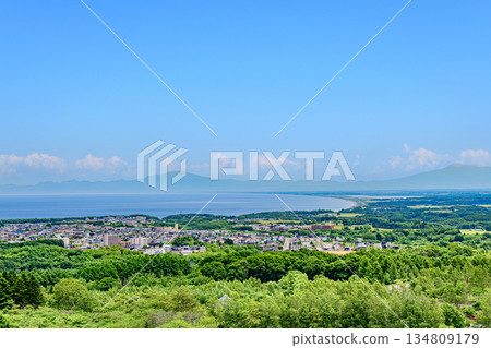 A view of the city and the Shiretoko mountain range from Mount Tento in Abashiri A view of the city and the Shiretoko mountain range from Mount Tento in Abashiri 134809179