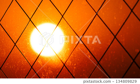 Orange sun seen from the hotel window 134809829