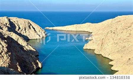 Bay Mouth Opening To Blue Sea, Gentle Tidal Flow Between Sandstone Cliffs With Azure Water Meeting Horizon, Calm Reflection And Navigation Potential For Coastal Survey And Maritime Lifestyle Visuals Bay Mouth Opening To Blue Sea, Gentle Tidal Flow Between Sandstone Cliffs With Azure Water Meeting Horizon, Calm Reflection And Navigation Potential For Coastal Survey And Maritime Lifestyle Visuals 134810338