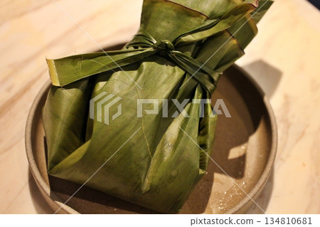 Indian cuisine: Shrimp curry wrapped in banana leaves Indian cuisine: Shrimp curry wrapped in banana leaves 134810681