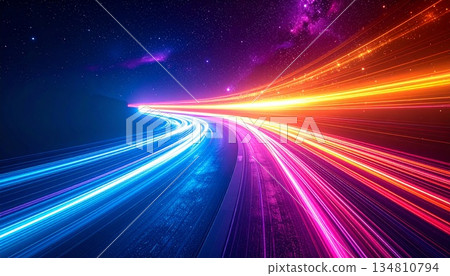 A stunning long-exposure photograph of a multi-lane highway at night, capturing vibrant, high-speed light trails in striking blue, magenta, and red neon colors. The dynamic streaks, future technology 134810794