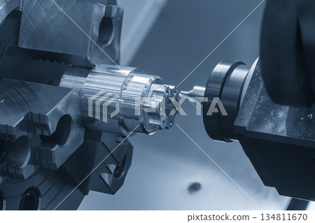 The multi tasking CNC lathe machine Swiss type drill cutting process the metal tube parts in the light blue scene. The multi tasking CNC lathe machine Swiss type drill cutting process the metal tube parts in the light blue scene. 134811670