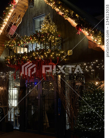 Christmas windows in a wooden house Christmas windows in a wooden house 134813038