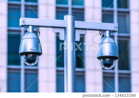 Tokyo cityscape in Japan at the end of the year... Security camera on a street corner. Tokyo Station (Nihonbashi Exit), security camera near the sidewalk of the bus lot. Tokyo cityscape in Japan at the end of the year... Security camera on a street corner. Tokyo Station (Nihonbashi Exit), security camera near the sidewalk of the bus lot. 134813100