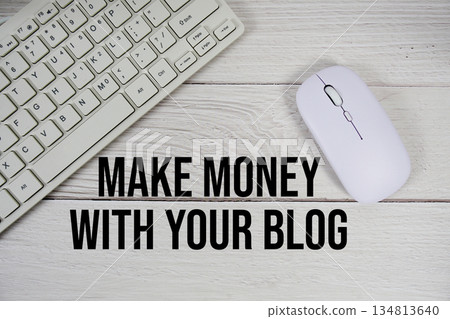 Make Money with Your Blog text with keyboard and wireless mouse on wooden background 134813640