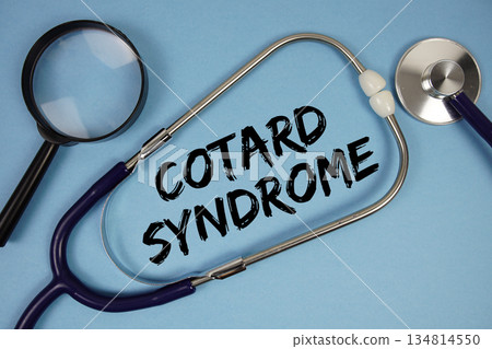 Cotard Syndrome text with Stethoscope and magnifying glass on blue background 134814550