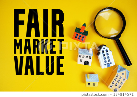 FMV Fair Market Value text with house models and magnifying glass on yellow background 134814571