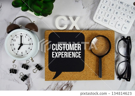CX - Customer Experience acronym with calculator, alarm clock and magnifying glass, business concept background CX - Customer Experience acronym with calculator, alarm clock and magnifying glass, business concept background 134814623