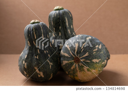 Green butternut squash pumpkin on brown background 134814698