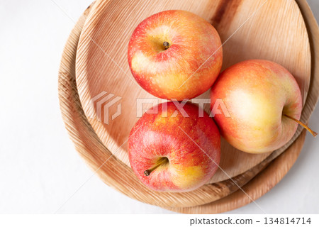 Red apple fruit (Gala apple) in natural plate on white background, Top view Red apple fruit (Gala apple) in natural plate on white background, Top view 134814714