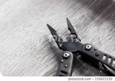 Compact multitool with textured grip, Multifunctional camping and repair tool with rugged design 134815330