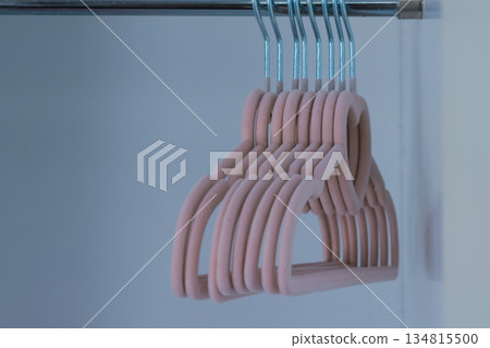 Children's pink velvet hangers with heart for girls clothes in empty wardrobe 134815500