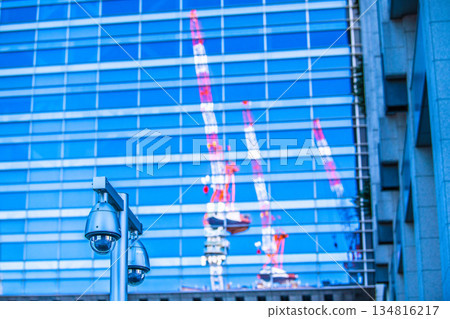 Tokyo cityscape in Japan at the end of the year... Security camera on a street corner. Tokyo Station (Nihonbashi Exit), security camera near the sidewalk of the bus lot. 134816217