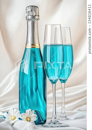 Luxurious turquoise sparkling wine with crystal glasses on a white silk backdrop for elegant celebrations and events 134816411