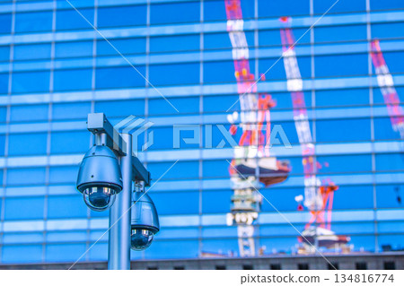 Tokyo cityscape in Japan at the end of the year... Security camera on a street corner. Tokyo Station (Nihonbashi Exit), security camera near the sidewalk of the bus lot. 134816774