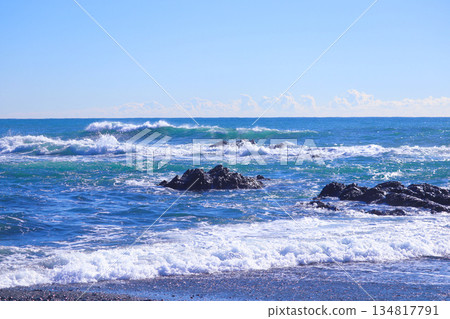 White waves crashing against the reef and the blue sea 134817791
