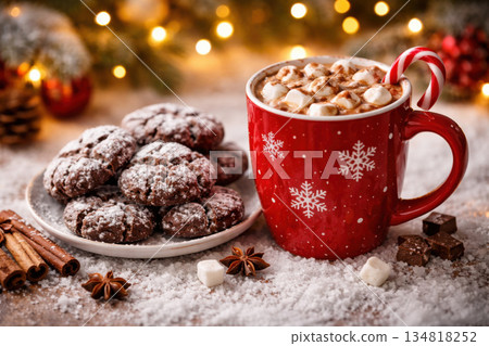 Cozy Christmas holiday scene with red mug of hot chocolate beverage and delicious cookie dessert on snowy tabletop. This warm festive image captures comforting moment Cozy Christmas holiday scene with red mug of hot chocolate beverage and delicious cookie dessert on snowy tabletop. This warm festive image captures comforting moment 134818252