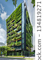 green plants and garden on modern glass skyscraper office building, nature and contemporary architecture, balance and harmony of environment and human, sustainability of ecosystem 134819271