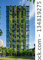 green plants and garden on modern glass skyscraper office building, nature and contemporary architecture, balance and harmony of environment and human, sustainability of ecosystem 134819275