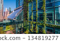 green plants and garden on modern glass skyscraper office building, nature and contemporary architecture, balance and harmony of environment and human, sustainability of ecosystem 134819277