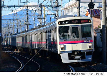 Keio 7000 series 7721F running with Mount Fuji in the background Keio 7000 series 7721F running with Mount Fuji in the background 134819488