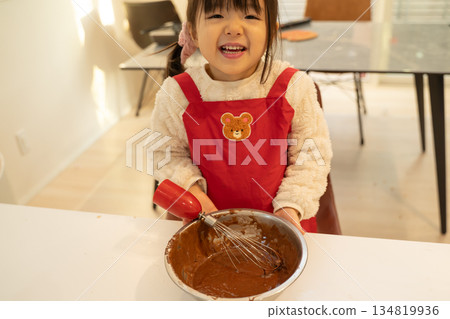 Girl making handmade Valentine's chocolate 134819936