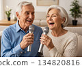 Elderly man and woman singing karaoke together in a cozy modern living room 134820816