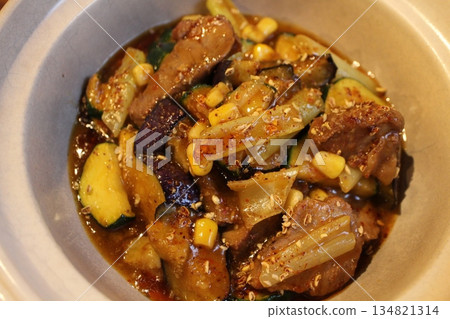 Chinese cuisine: Pork cheek, eggplant and zucchini stir-fried with black vinegar Chinese cuisine: Pork cheek, eggplant and zucchini stir-fried with black vinegar 134821314