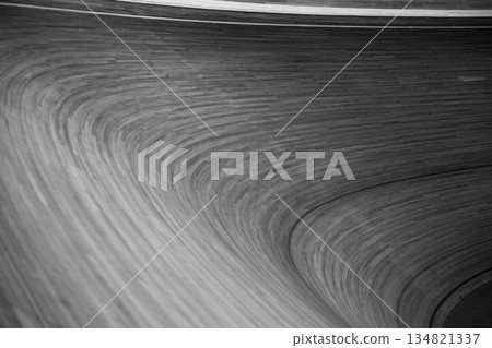 Black and white photo of sharp, steep turn on cycling track. Backdrop for negative situation at sports competition. Accident on cycling track, sad emotions from sports concept 134821337