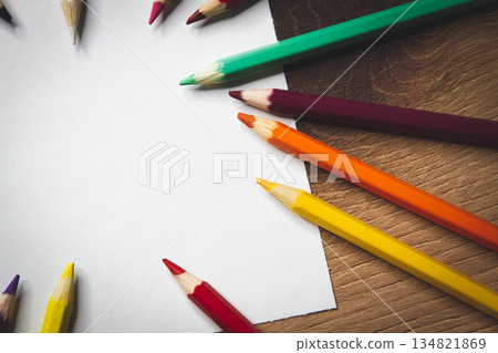 Colored pencils and white paper. Children's creativity. Template for drawing. 134821869