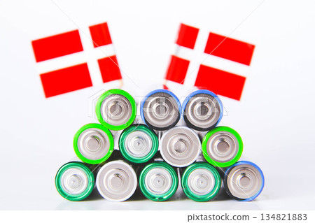 Battery. A lot of batteries on the background of the flag of the country. Battery. A lot of batteries on the background of the flag of the country. 134821883