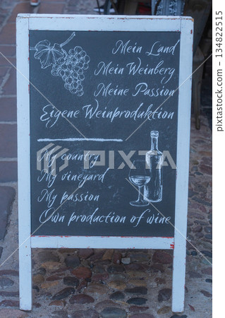 Chalkboard sign with wine list outside a local bar. Authentic street detail, European lifestyle, Italy Chalkboard sign with wine list outside a local bar. Authentic street detail, European lifestyle, Italy 134822515