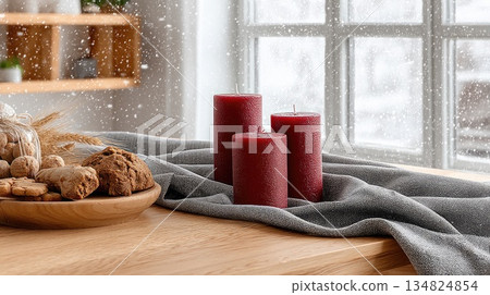 Warm candlelit display with cookies and greenery in a cozy winter setting 134824854