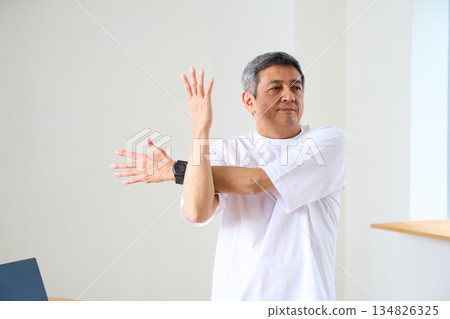 Senior men stretching 134826325