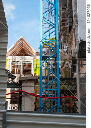 City Construction Site with Blue Crane and Scaffolding City Construction Site with Blue Crane and Scaffolding 134827068